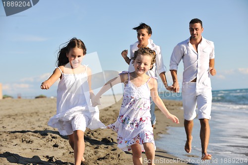 Image of happy young  family have fun on beach