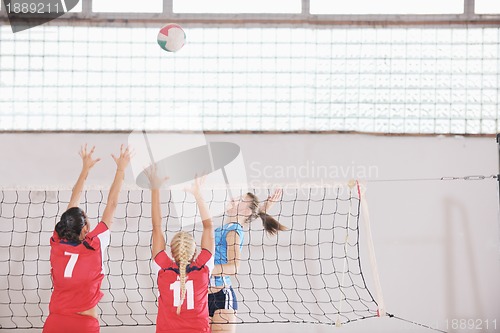 Image of girls playing volleyball indoor game