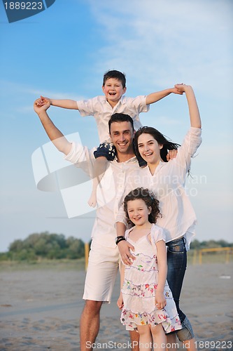 Image of happy young family have fun on beach