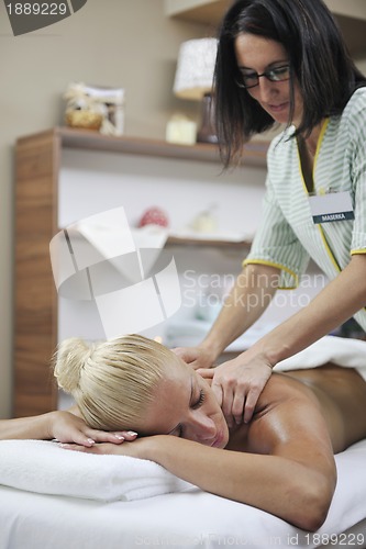 Image of woman at spa and wellness back massage