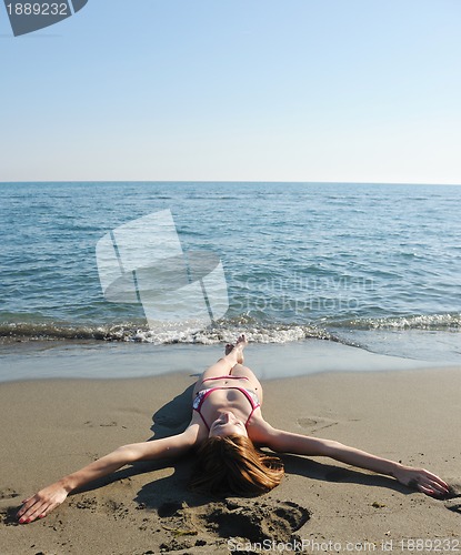 Image of young woman relax  on beach