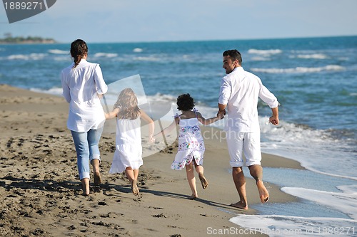 Image of happy young  family have fun on beach