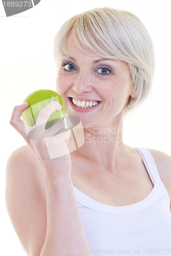 Image of happy  young  woman eat green apple isolated  on white