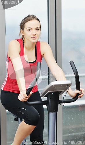 Image of woman workout  in fitness club on running track 