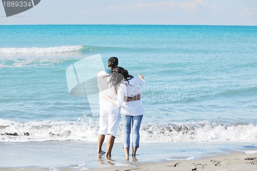 Image of happy young couple have fun at beautiful beach