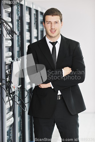 Image of young it engeneer in datacenter server room