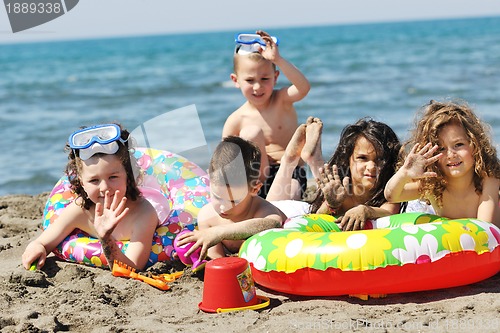 Image of child group have fun and play with beach toys