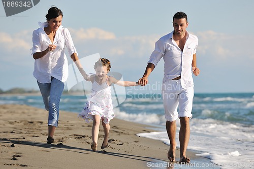 Image of happy young  family have fun on beach