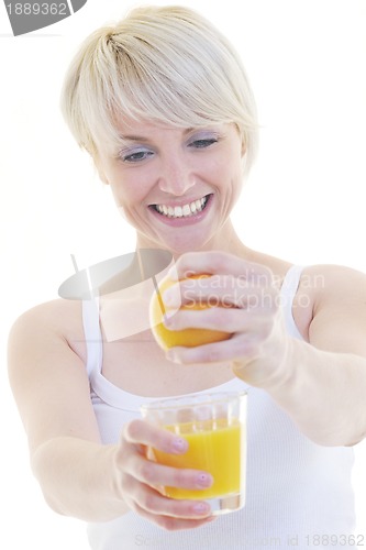 Image of Young woman squeeze orange juice