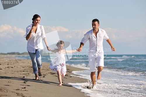 Image of happy young  family have fun on beach
