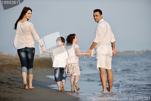 Image of happy young family have fun on beach