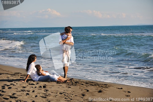 Image of happy young  family have fun on beach