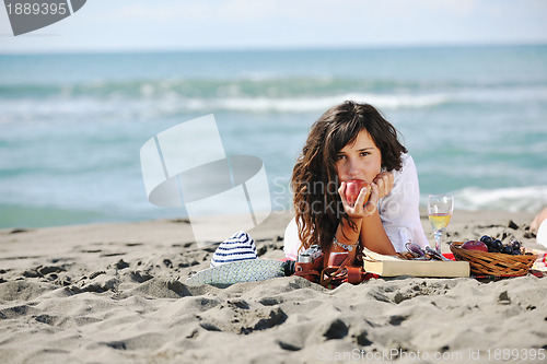 Image of happy young woman on beach