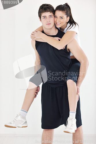Image of happy young couple fitness workout and fun