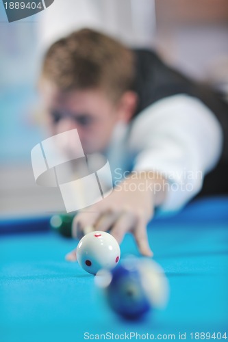 Image of young man play pro billiard game 