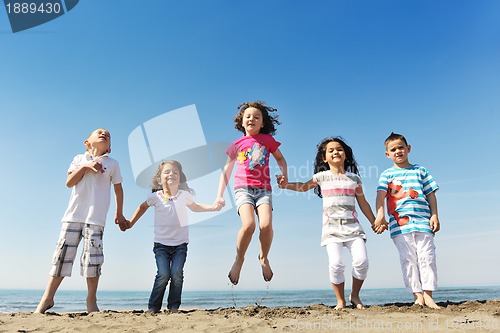 Image of happy young  people group have fun on beach