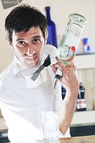 Image of pro barman prepare coctail drink on party