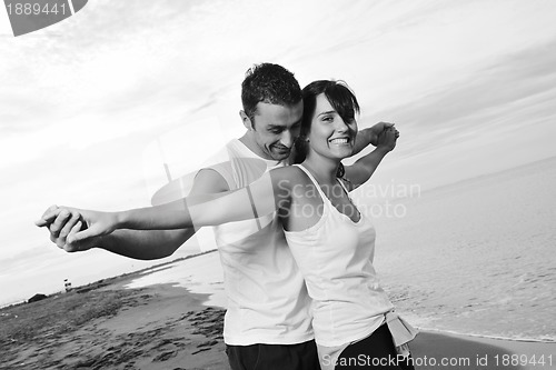 Image of happy young couple have fun at beautiful beach