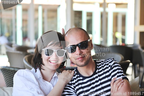 Image of happy young couple have fun on beach