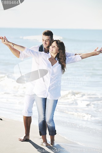 Image of happy young couple have fun at beautiful beach