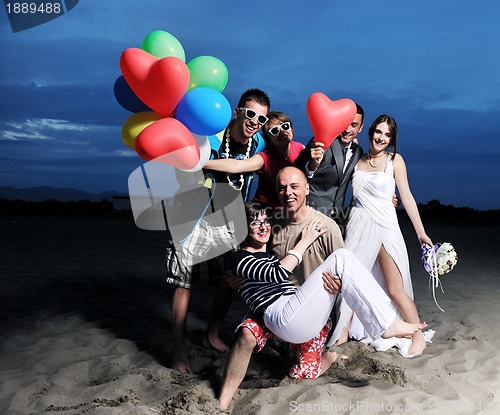 Image of happy young  people group have fun on beach