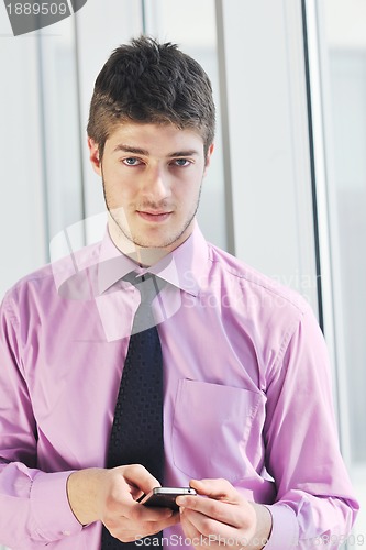 Image of young business man talk by cellphone