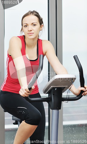 Image of woman workout  in fitness club on running track 