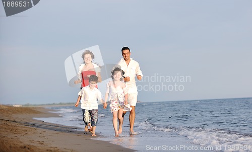 Image of happy young family have fun on beach