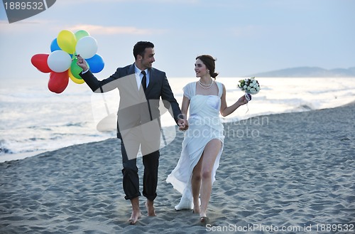 Image of romantic beach wedding at sunset