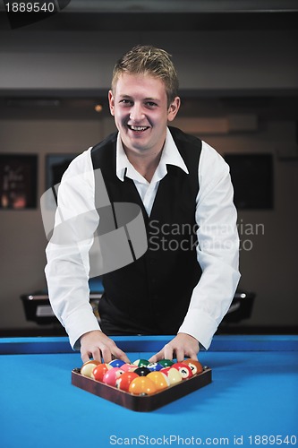 Image of young man play pro billiard game 