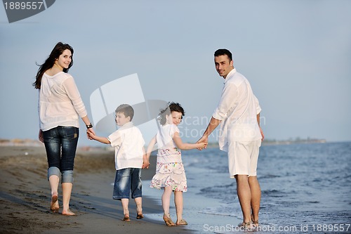 Image of happy young family have fun on beach