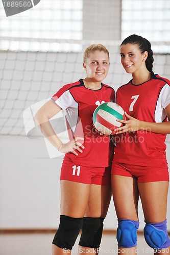 Image of girls playing volleyball indoor game