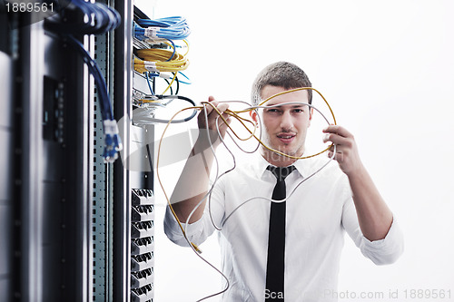 Image of young it engeneer in datacenter server room