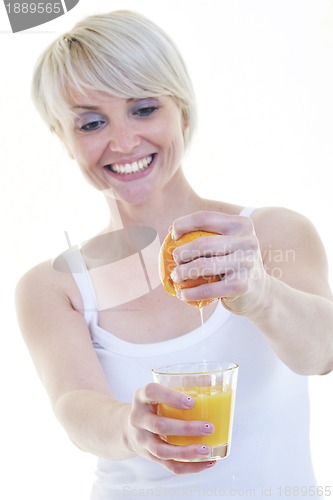 Image of Young woman squeeze orange juice