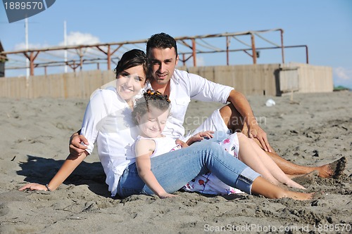 Image of happy young  family have fun on beach