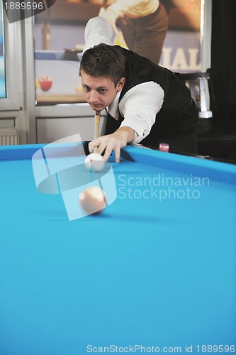 Image of young man play pro billiard game 