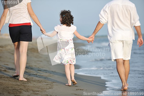 Image of happy young family have fun on beach