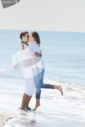 Image of happy young couple have fun at beautiful beach