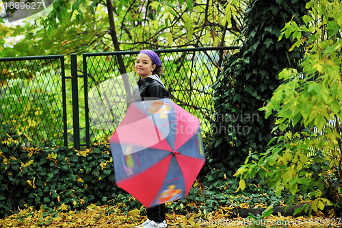 Image of happy girl with umbrella