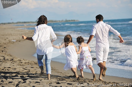 Image of happy young  family have fun on beach