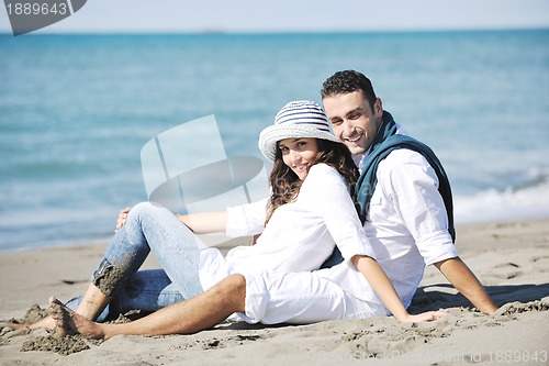 Image of happy young couple have fun at beautiful beach