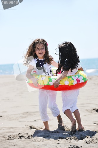 Image of happy young  people group have fun on beach