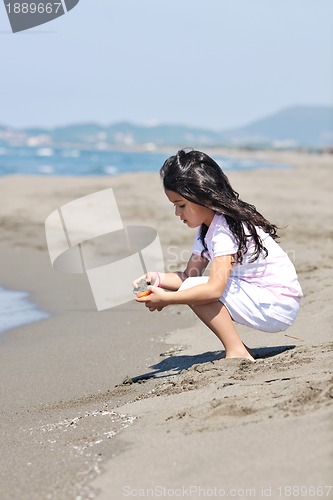 Image of little female  child portrait on the beach