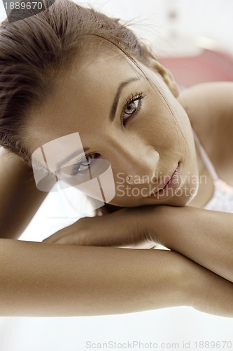 Image of Beautiful young woman tanning in solarium