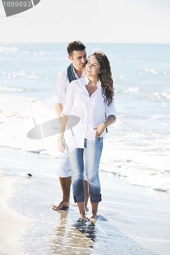 Image of happy young couple have fun at beautiful beach