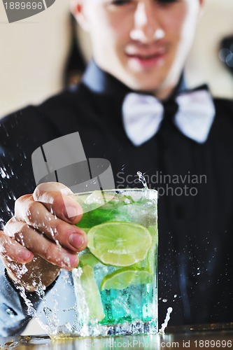 Image of pro barman prepare coctail drink on party