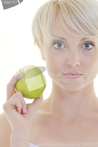 Image of happy  young  woman eat green apple isolated  on white