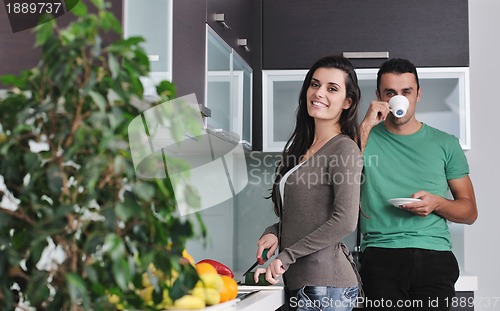 Image of young couple have fun in modern kitchen