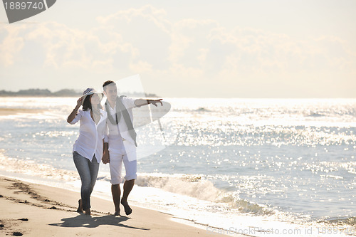 Image of happy young couple have fun at beautiful beach