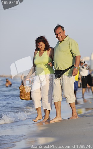 Image of happy seniors couple  on beach